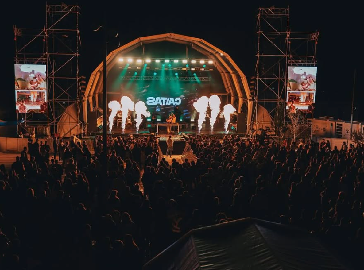 CAITAS playing a festival set in front of a large crowd